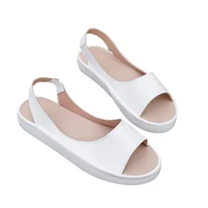Elegant white flat sandals for women featuring a peep-toe design and elastic slingback strap