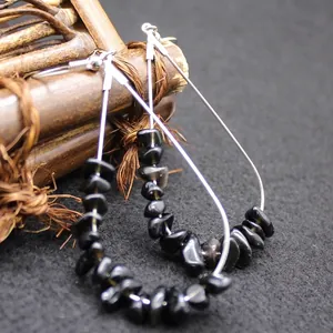 Bohemian teardrop hook earrings featuring natural black crystal stone chips in silver
