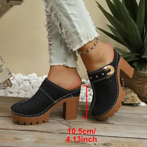 Detailed view of fashionable black closed-toe platform mules with a 10.5cm high chunky heel
