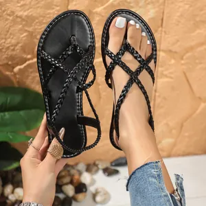 Detail shot of black braided thong sandals with elastic back strap for women