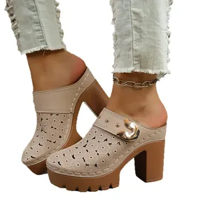 Stylish women's closed-toe platform mules with floral laser-cut details and chunky high heels
