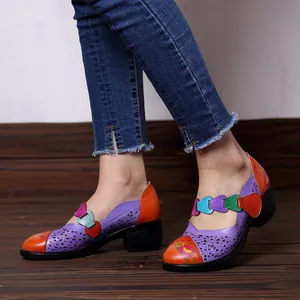 Detailed side view of retro macaron-colored printed Mary Jane sandals worn by model.