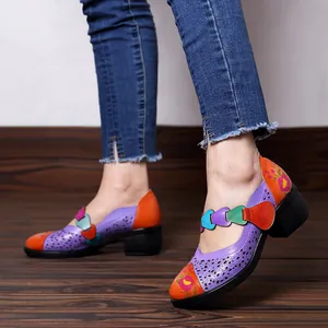 Detailed side view of vintage colorful hollow-out Mary Jane shoes featuring floral prints