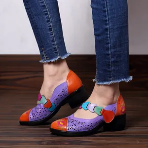 Close-up of vintage colorful hollow-out Mary Jane shoes for women with floral print