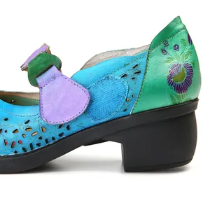 Close-up of retro Mary Jane shoe with floral print and star-shaped hollow details.