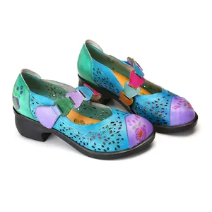 Detailed view of colorful retro Mary Jane shoes with laser-cut floral patterns