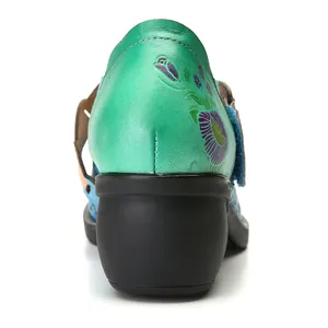 Detailed back view of retro green printed leather Mary Jane shoes showing floral patterns