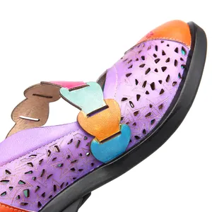 Detailed macro view of retro macaron leather Mary Jane shoes featuring laser-cut star patterns.