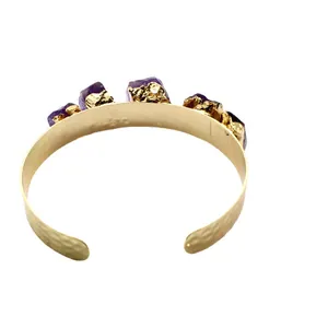 Unique gold-plated open cuff bracelet featuring irregular raw amethyst stones