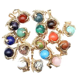 Collection of golden dragon claw pendants holding colorful round natural gemstone beads