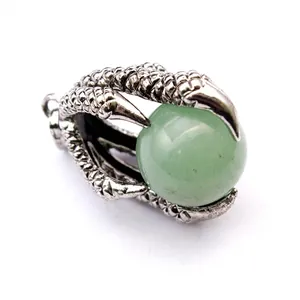 Detailed view of silver dragon claw pendant holding a green aventurine stone bead