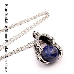 Detailed view of medieval dragon claw pendant necklace with a blue sodalite stone bead
