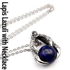 Detailed view of a vintage medieval dragon claw pendant with a lapis lazuli stone