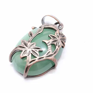 Vintage medieval style bronze double flower pendant with large green oval stone