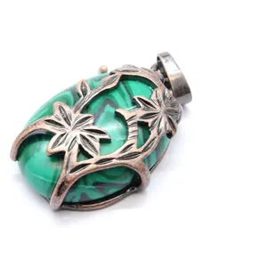 Exquisite vintage medieval style pendant with green stone and bronze double flower relief frame