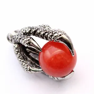 Vintage dragon claw pendant clutching a red round bead, medieval gothic style jewelry accessory