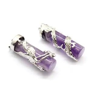 Close-up detail of amethyst cylinder pendants with intricate silver dragon and phoenix wrap
