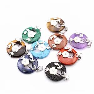 Variety of natural stone circular pendants with silver flower overlays on white background