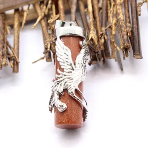 Close-up of a sparkling goldstone cylinder pendant with a silver phoenix wrap detail.