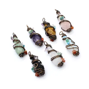 Variety of faceted crystal pendants wrapped in vintage style copper wire decor