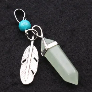 Detail view of light green hexagonal crystal pendant with silver feather charm.