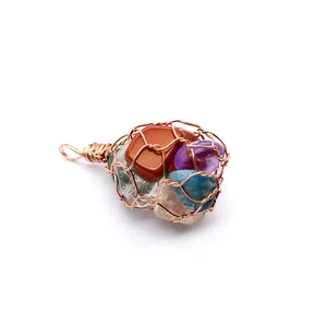 Detailed view of wire wrapped pendant with assorted natural crystal tumbled stones