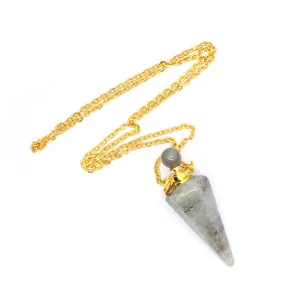 Close-up detail of a Labradorite hexagonal crystal perfume bottle pendant with golden chain