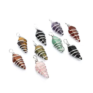Detailed view of wire-wrapped hexagonal crystal cone pendants in various natural stones