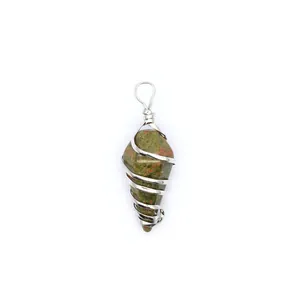 Detail view of a hexagonal cone Unakite crystal wire wrapped pendant necklace.