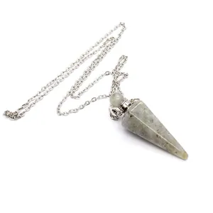 Detailed view of a conical flash stone crystal perfume bottle pendant with silver chain.