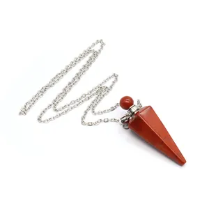 Detailed macro view of a red jasper hexagonal crystal perfume bottle pendant with chain