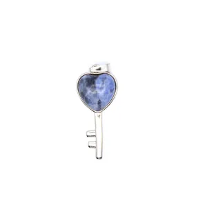 Detailed view of a heart-shaped blue mottled natural stone key pendant necklace jewelry.