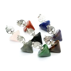 Detail view of tree of life crystal dowsing pendulum pendants in assorted gemstones