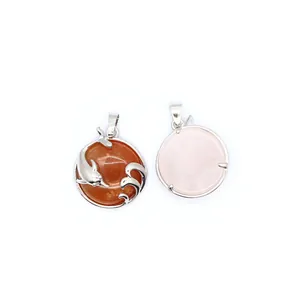 Detailed close-up view showing a dolphin pendant with red aventurine and rose quartz.