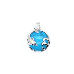 Dolphin playing with waves pendant necklace featuring blue turquoise stone inlay detail