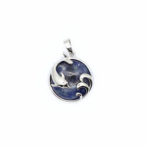Close-up of silver-toned dolphin pendant necklace with blue sodalite gemstone inlay charm