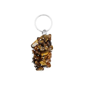 Detailed view of irregular tiger eye stone chips on a sturdy silver metal keychain ring