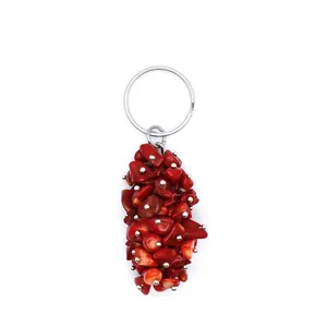 Detailed view of a unique keychain featuring a cluster of vibrant red crystal crushed stones.