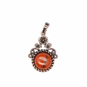 Ciondolo vintage in rame a forma di fiore con cabochon in agata rossa liscia