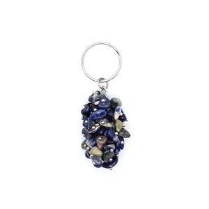 Detailed close-up of natural blue crystal gravel pendant on a silver keychain loop
