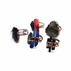 Selection of bohemian open rings featuring raw labradorite and colorful natural stones