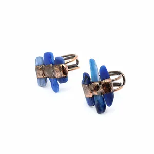 Detailed view of blue kyanite raw stone rings with vintage copper bands