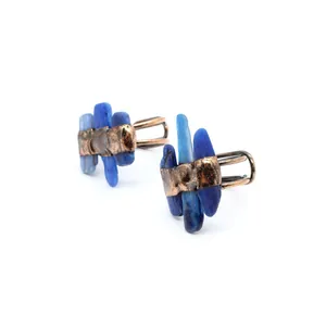 Detailed macro shot of a vintage open ring featuring vibrant blue raw labradorite stones