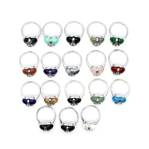 Collection of assorted heart-shaped gemstone rings with silver bands in various vibrant colors