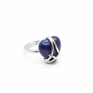 Close-up detail of a silver ring featuring a heart-shaped blue Lapis Lazuli gemstone.