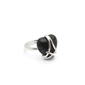 Detailed view of a silver heart-shaped lava stone ring with minimalist wire wrapping