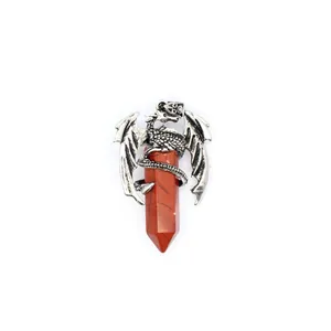 Detailed macro view of a silver dragon wrapped around a red jasper stone pillar pendant