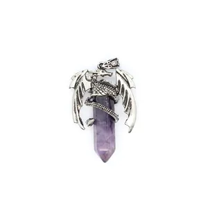 Detailed view of an antique silver dragon wrapped around a purple crystal point pendant.