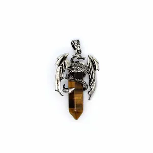Detailed view of antique silver dragon wrapping a Tiger's Eye hexagonal crystal pendant