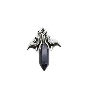 Close-up of antique silver dragon wings holding a blue goldstone hexagonal crystal pendant